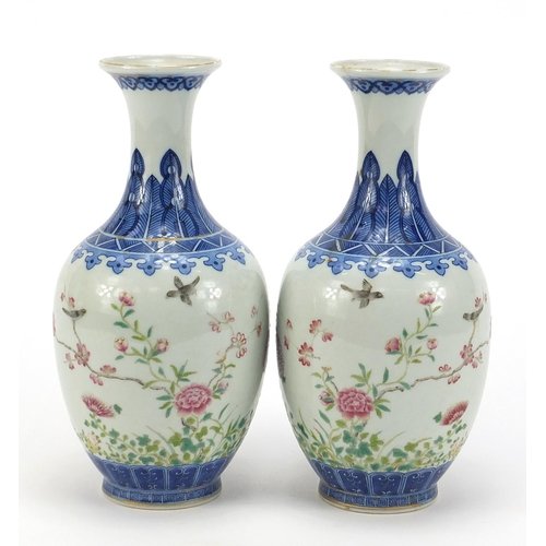 272 - Pair of Chinese blue and white porcelain vases hand painted in the famille rose palette with birds a... 