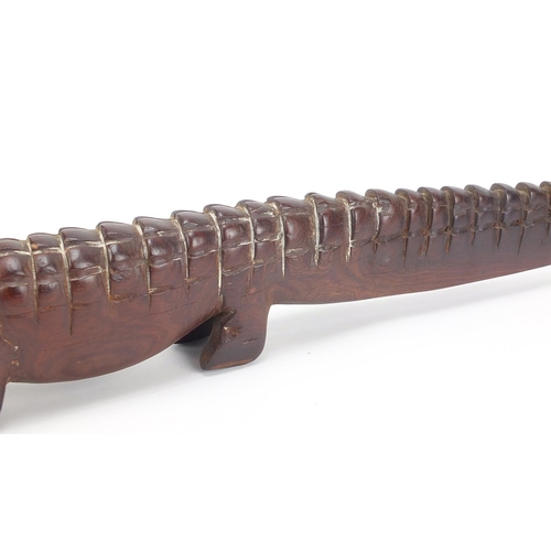 597 - Large African tribal interest carved hardwood alligator with bone teeth, 80cm in length