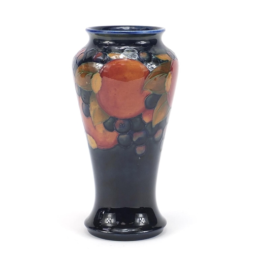 39 - William Moorcroft pottery baluster vase hand painted in the Pomegranate pattern, 23cm high