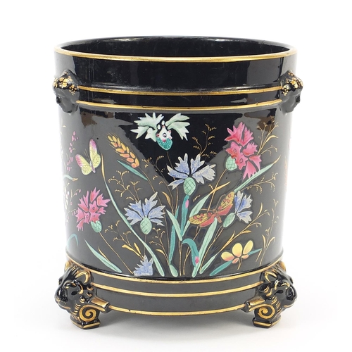 73 - Victorian aesthetic three footed jardinière with masks, enamelled with butterflies amongst flowers, ... 