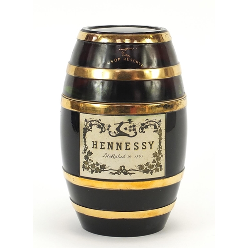 1086 - Bottle of Hennessey cognac housed in a barrel design glass bottle, 19cm high