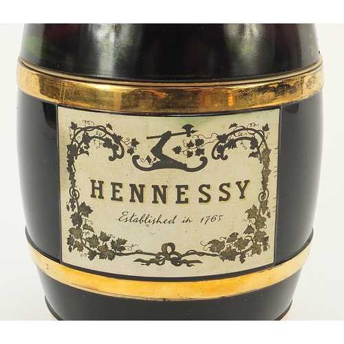 1086 - Bottle of Hennessey cognac housed in a barrel design glass bottle, 19cm high