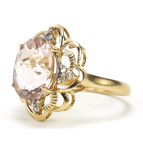 1117 - 9ct gold pink stone and diamond ring with pierced setting, size N, 4.0g