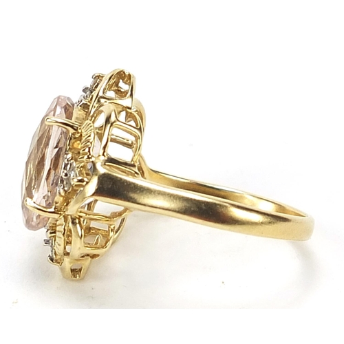 1117 - 9ct gold pink stone and diamond ring with pierced setting, size N, 4.0g