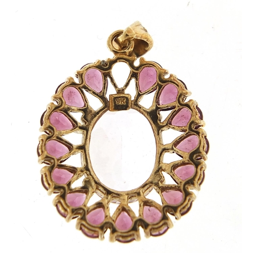 765 - 9ct gold purple and clear stone pendant, 2.6cm high, 3.9g