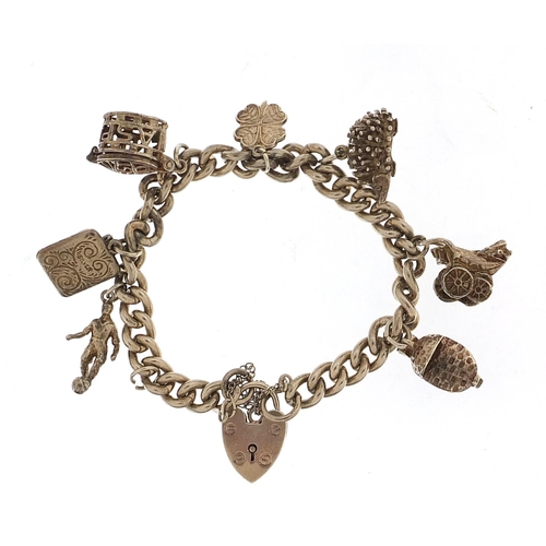 1026 - Silver charm bracelet with a selection of charms including babies' carriage, hedgehog and footballer... 