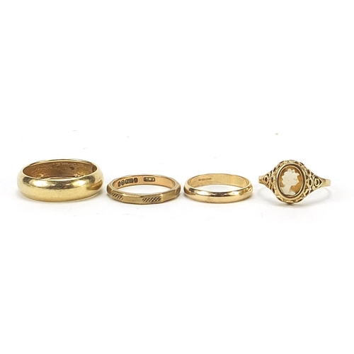 768 - Three 9ct gold wedding bands and a 9ct gold cameo ring, various sizes, total 6.5g