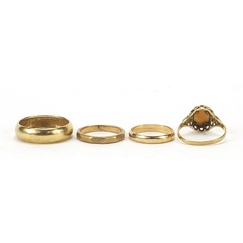 768 - Three 9ct gold wedding bands and a 9ct gold cameo ring, various sizes, total 6.5g