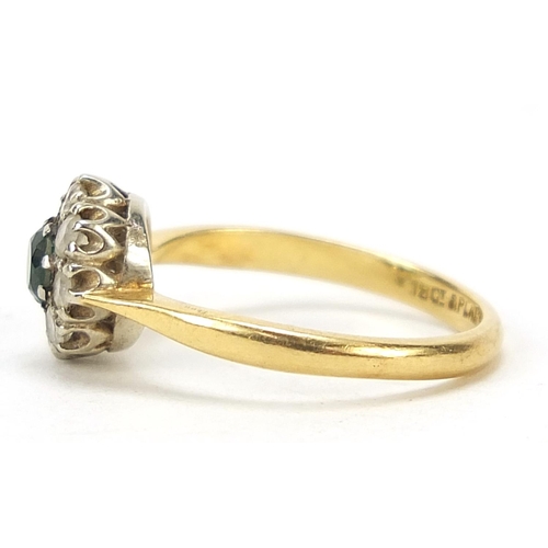 663 - 18ct gold green and clear stone flower head ring, size I/J, 2.6g