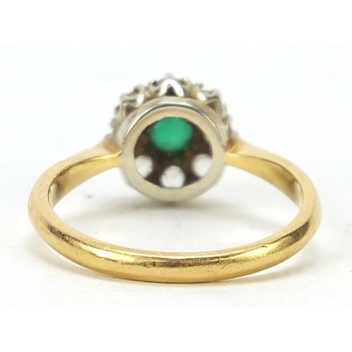 663 - 18ct gold green and clear stone flower head ring, size I/J, 2.6g