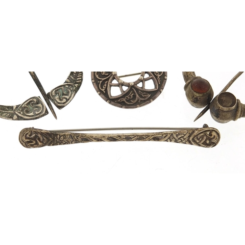 850 - Four Scottish silver brooches including two Plaid brooches, the largest 7.2cm wide, 34.4g