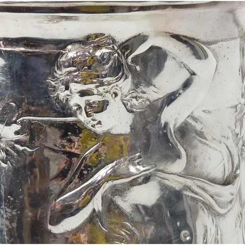 608 - Large classical silver plated stein decorated in relief with a maiden and Putti, 42cm high