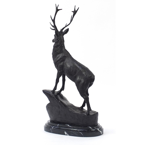 152 - Large patinated bronze stag raised on a shaped marble base, 74cm high