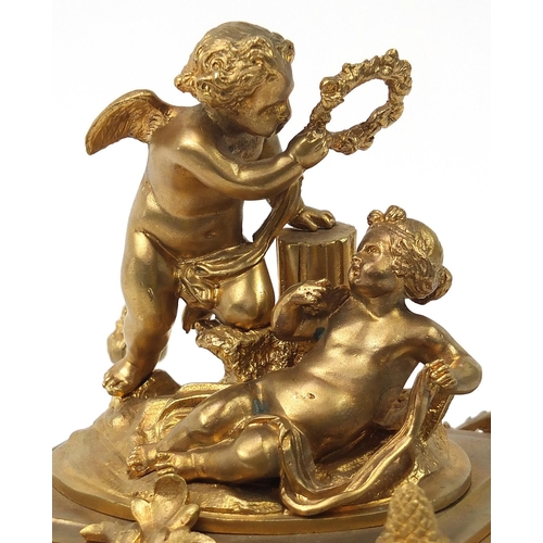 481 - Continental gilt bronze mantle clock with porcelain panels decorated with Putti, 29.5cm high