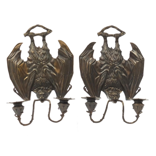 327 - Pair of Art Nouveau design patinated bronze two branch bat design wall sconces, each 36cm high