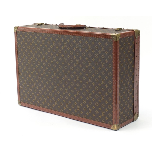 585 - Louis Vuitton, early 20th century suitcase with lift out tray, various impressed marks to the mounts... 