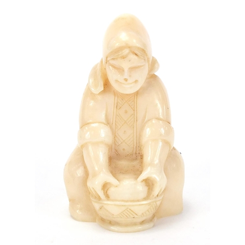 158 - Inuit type marine ivory carving of a female, inscised marks to the underside, 6cm high