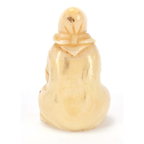 158 - Inuit type marine ivory carving of a female, inscised marks to the underside, 6cm high