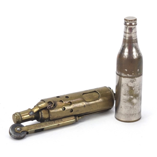 753 - Two military interest trench art lighters including one in the form of a bottle, the largest 7.5cm h... 