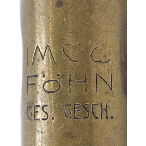 753 - Two military interest trench art lighters including one in the form of a bottle, the largest 7.5cm h... 