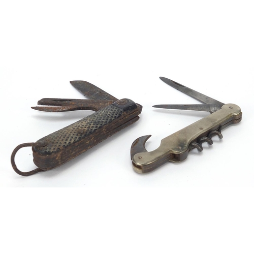 756 - Two military interest folding pocket multi tools including one with corkscrew and Sheffield steel bl... 