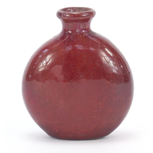 870 - Continental red glazed pottery flask hand painted with a portrait inscribed Ed VVar, 10.5cm high