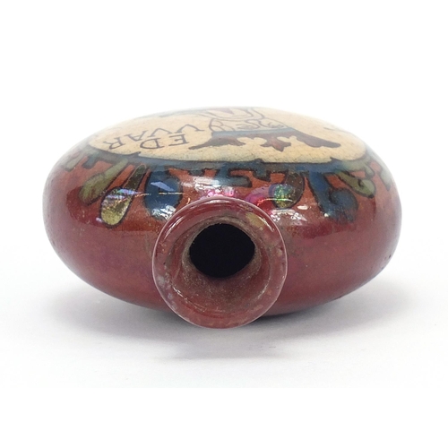 870 - Continental red glazed pottery flask hand painted with a portrait inscribed Ed VVar, 10.5cm high