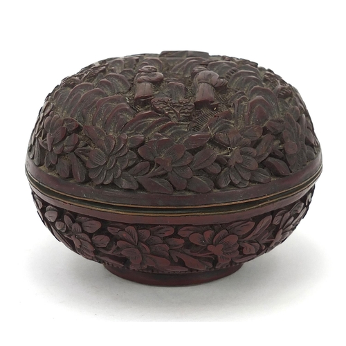 931 - Chinese cinnabar lacquer box and cover carved with two figures in a landscape, 8.5cm in diameter