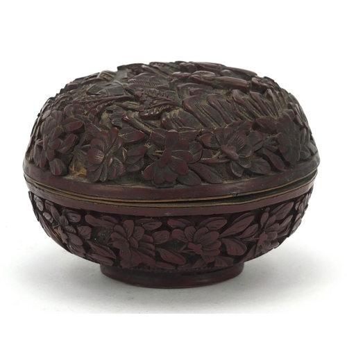 931 - Chinese cinnabar lacquer box and cover carved with two figures in a landscape, 8.5cm in diameter