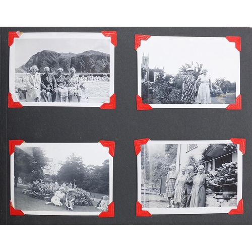 956 - Early 20th century social history photographs arranged in two albums including beach scenes, railway... 