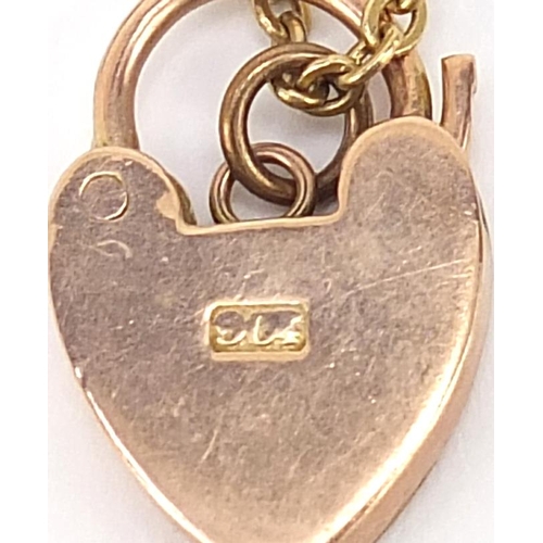 211 - Unmarked gold bracelet, (tests as 9ct gold) with a 9ct gold loveheart padlock, 16cm in length, 7.8g