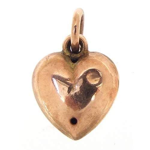 248 - Antique unmarked gold and enamel love heart charm, set with a seed pearl, 1.2cm high, 0.8g