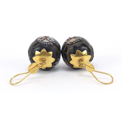 852 - Pair of Islamic unmarked gold mounted glass earrings, hand painted with face masks, 4cm high, 13.0g