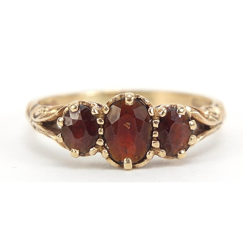 665 - Antique design 9ct gold garnet three stone ring, size Q, 3.0g