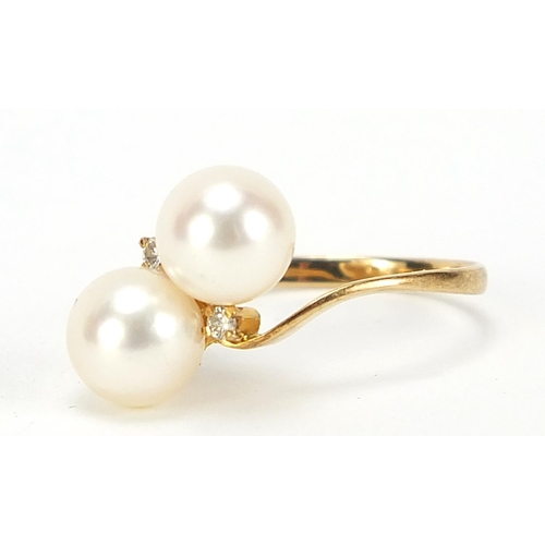 495 - 18ct gold cultured pearl and diamond crossover ring, size L, 2.3g