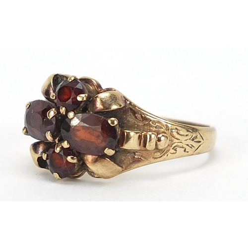 849 - 9ct gold garnet cluster ring, size O, 2.5g