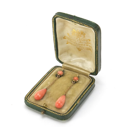 63 - Pair of antique unmarked gold pink coral drop earrings, housed in a Reid & Sons tooled leather box, ... 