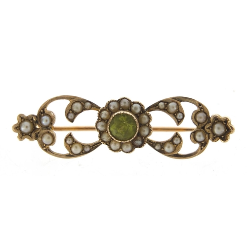 743 - 9ct gold peridot and seed pearl bar brooch, housed in a Gieve Matthews & Seagrove Ltd tooled leather... 