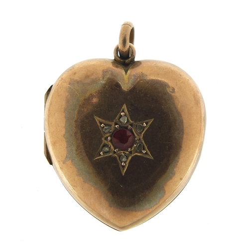 656 - Gold coloured metal ruby and diamond love heart locket, 2.5cm high, 7.0g