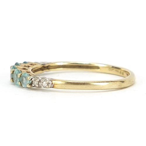 504 - 9ct gold blue zircon and diamond half eternity ring, size L, 1.2g