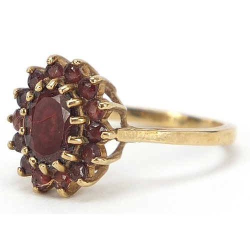 1025 - 9ct gold garnet cluster ring, size M, 3.2g