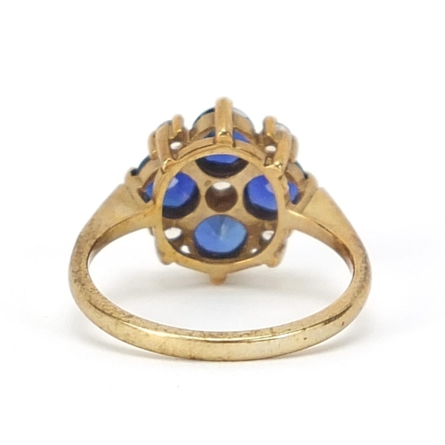 1076 - 9ct gold blue and white stone cluster ring, size J, 2.5g