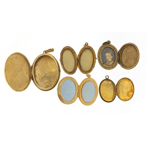 312 - Five 9ct gold front and back and rolled gold lockets, the largest 5cm high, total 36.0g