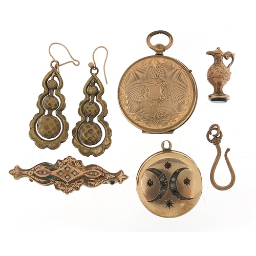 697 - Victorian and later gilt metal jewellery including lockets, bar brooch, earrings and charm, the larg... 