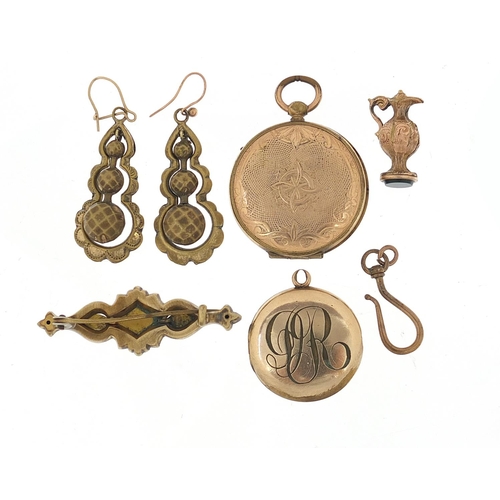 697 - Victorian and later gilt metal jewellery including lockets, bar brooch, earrings and charm, the larg... 