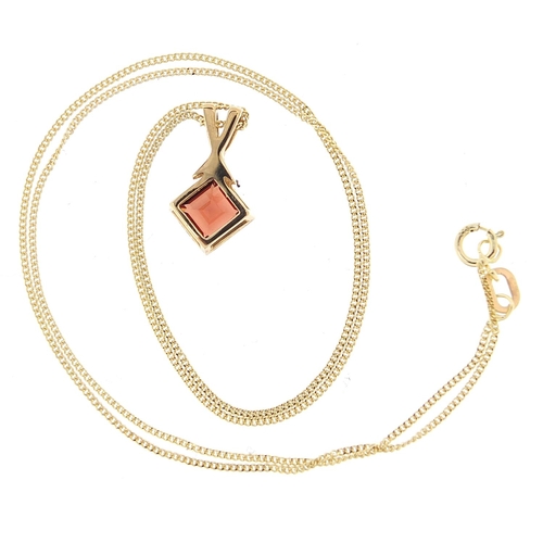 914 - 9ct gold garnet pendant on a 9ct gold necklace, 1.5cm high and 40cm in length, total 1.7g