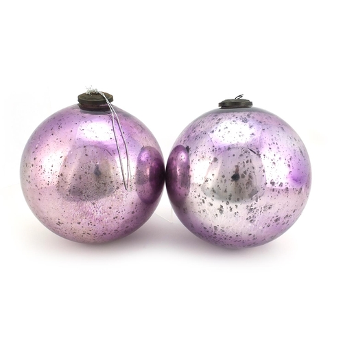 332 - Pair of large Victorian mirrored mauve glass witches balls, each approximately 25cm in diameter