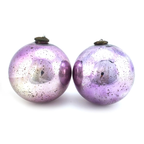 332 - Pair of large Victorian mirrored mauve glass witches balls, each approximately 25cm in diameter