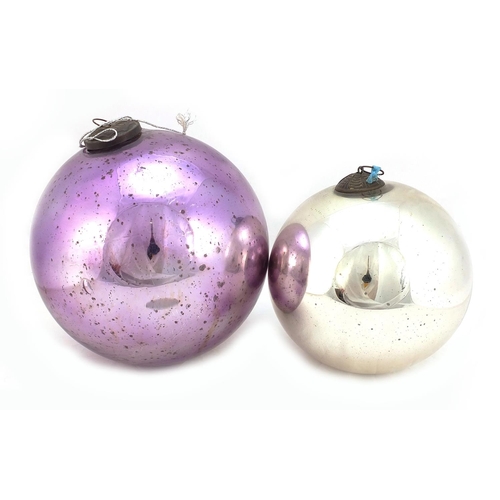 333 - Two large Victorian mirrored glass witches balls including a mauve example, the largest approximatel... 