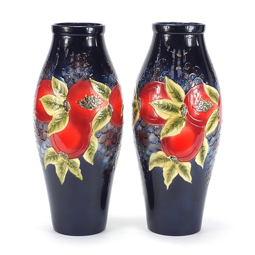 510 - Large pair of William Moorcroft style vases hand painted with fruit, each 40.5cm high